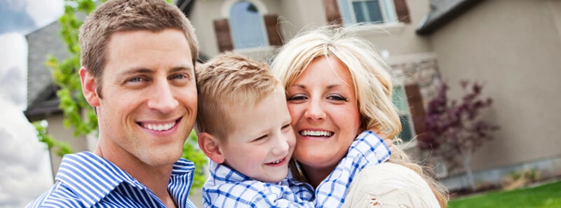 homeowner-standing-in-front-of-house