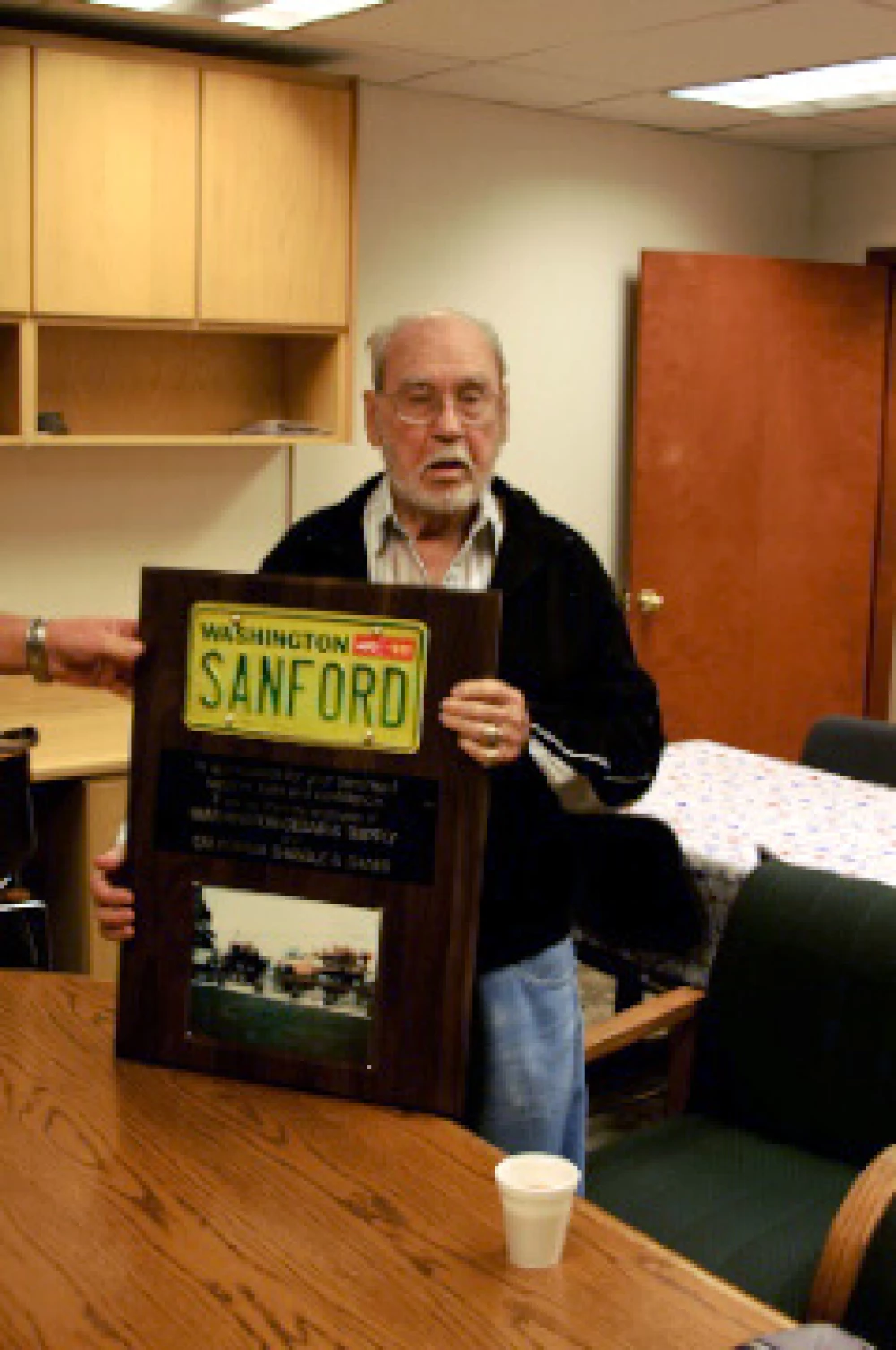 pat-with-brutsche-plaque