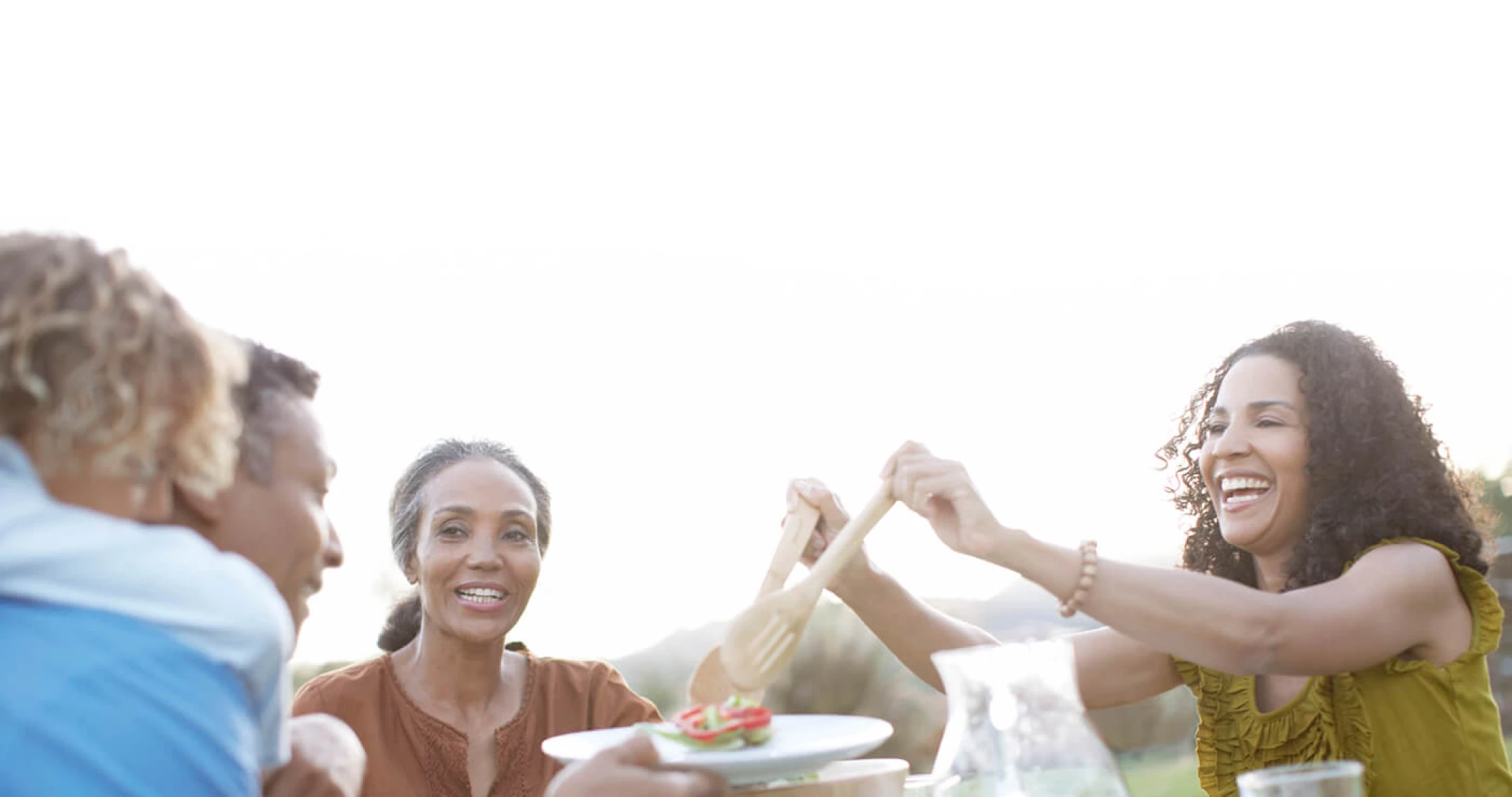 group-of-people-eating-lunch-outside